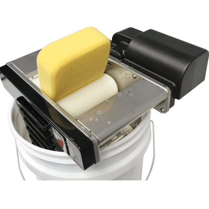 Automatic grout cleaner mounted on bucket with grout sponge